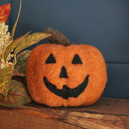 A view of an orange felt Pumpkin Halloween decoration