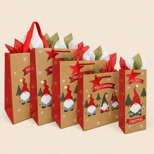 Assorted kraft Christmas gift bags in different sizes, featuring festive gnome designs, red handles, star tags and colourful tissue paper.
