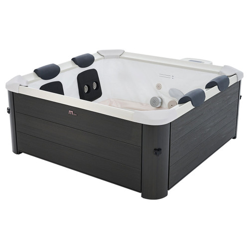 MSpa Oslo Plus 6 Person Hot Tub shown empty on a white background, highlighting the cushioned headrests, built-in hydro massage jets, and sleek carbon grey exterior.