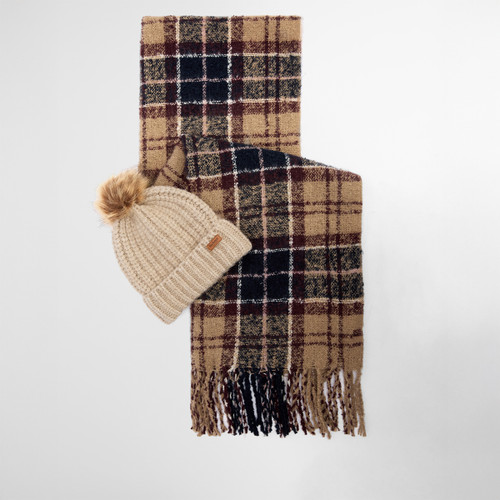 A beige knit beanie with a faux fur pom-pom and a plaid scarf in tan, burgundy, and navy, featuring tasselled ends, creating a cosy autumn vibe.