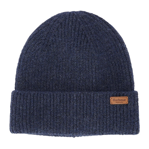A dark blue ribbed knit beanie with a folded brim showing a brown leather patch label. The texture looks soft and cosy, conveying warmth.
