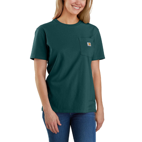 Woman wearing a dark green Carhartt short-sleeved T-shirt with a crew neck and left chest pocket displaying the Carhartt logo, paired with blue jeans, against a white background.