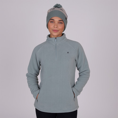 A front view of a woman wearing a sage Shires Aubrion half zip fleece