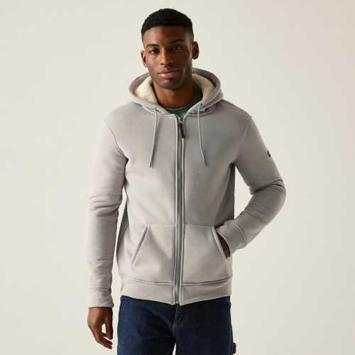 Man wearing the NADDLE full-zip fleece hoodie in grey marl, styled with dark jeans; features drawstring hood and kangaroo pockets, ideal for casual layering.