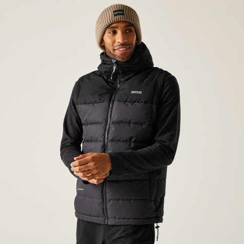 Men’s black Regatta Aldthorn bodywarmer with padded insulation and hood, layered over fleece for winter-ready casual outdoor look.