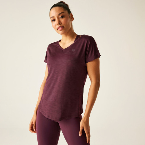 A woman wearing a dark red v-neck t-shirt.