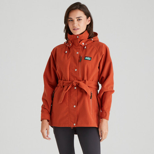 A front view of a woman wearing an orange Ridgeline monsoon nordic jacket A front view of a woman wearing an orange Ridgeline monsoon nordic jacket
