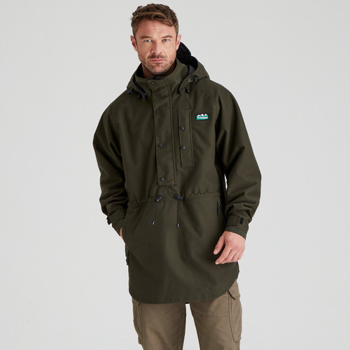 A front view of a man wearing a forest green Ridgeline Monsson Classic Smock A front view of a man wearing a forest green Ridgeline Monsson Classic Smock