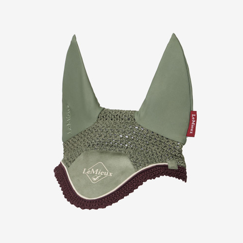 Olive green LeMieux horse fly hood with a crochet-style main section, soft fabric ears, and a maroon crochet trim along the lower edge, featuring the LeMieux logo on the front panel.