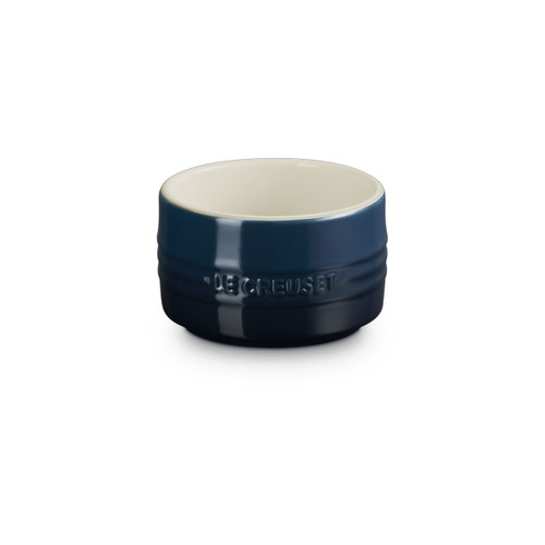 The front of a dark blue stackable ramekin.
