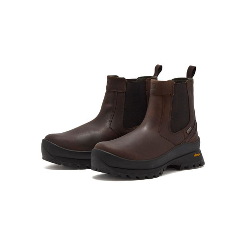 Brown leather Chelsea boots with black Vibram soles.