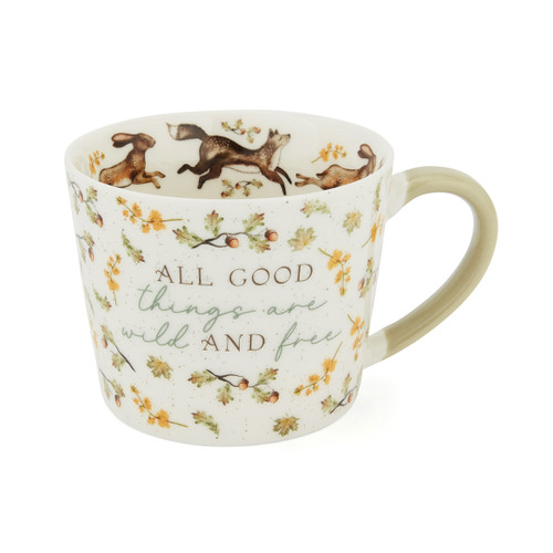 A view of a forest fable all good things mug on a white background