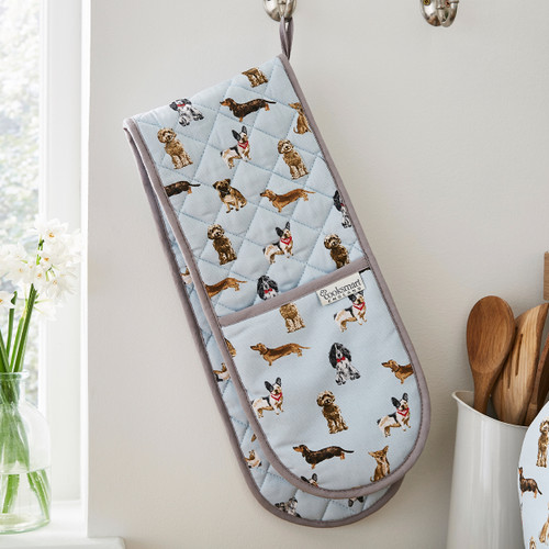 A view of a curious dogs double oven gloves hanging up