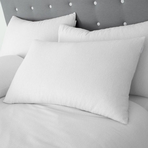 A view of a  pack of white cotton pillowcases on a bed