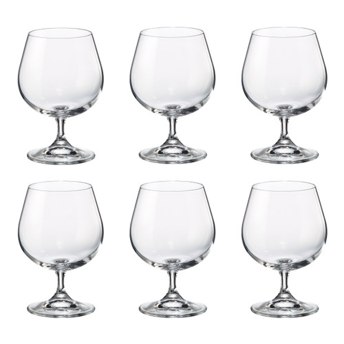 Siz clear brandy snifter with a wide, round bowl and short stem on a glossy white background, conveying elegance and simplicity.
