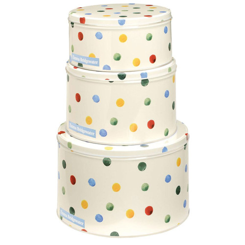 Stacked set of Emma Bridgewater polka dot cake tins in three sizes, featuring colourful red, blue, green, and yellow spots on a cream background.