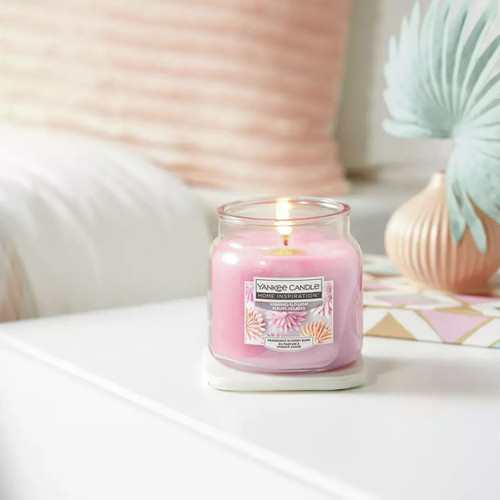 Yankee Candle Home Inspiration Sugared Blossom 340g jar candle lit on a white table with soft home décor, floral fragrance.