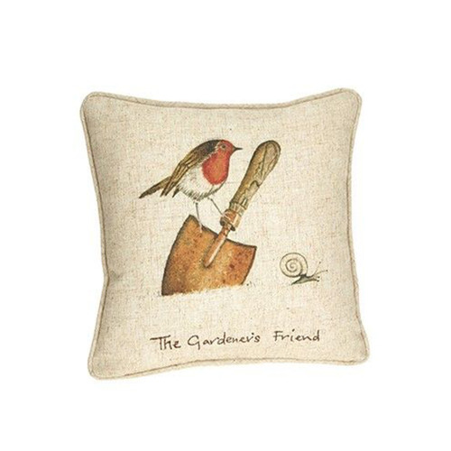 A decorative pillow features a hand-painted bird on a garden trowel with a small snail nearby. The text "The Gardener’s Friend" is written below.
