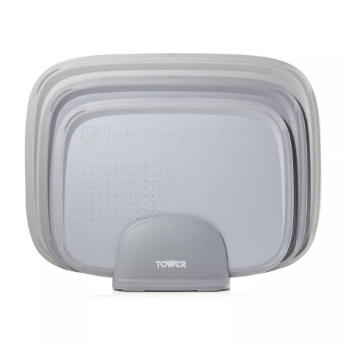 Stacked set of three grey chopping boards in varying sizes, neatly organized in a grey holder. The boards have subtle texture and measurement markings.