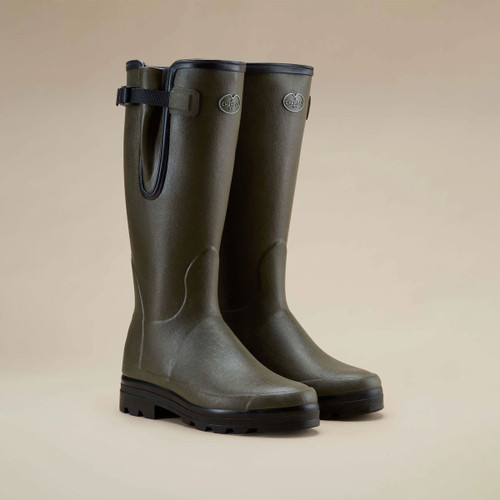 Le Chameau tall green wellington boots with adjustable waterproof gusset, side strap and black lugged soles.