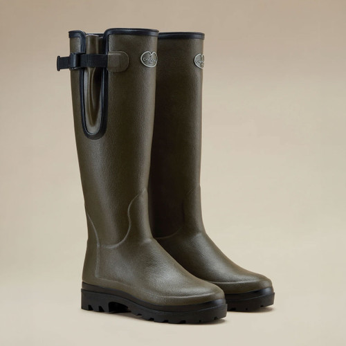 A view of a pair of women's Le Chameau Vierzonord Neoprene Lined Wellington Boots on a brown background