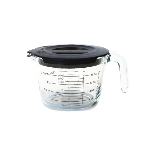 A side view of a 500ml glass measuring jug with a grey plastic lid.