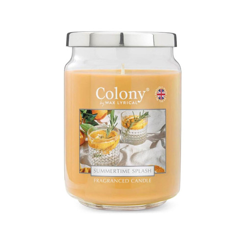 Colony Summertime Splash fragranced candle in a clear glass jar with silver lid, featuring golden wax and a label showing citrus drinks with rosemary, evoking a bright, refreshing summer scent.