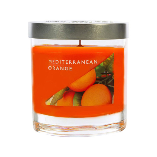 Mediterranean Orange fragranced candle in a clear glass jar with silver lid and vibrant orange wax, featuring a citrus fruit label evoking a fresh Mediterranean aroma.