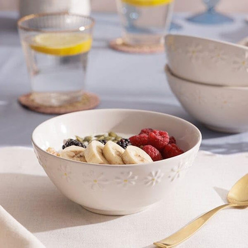 Price & Kensington Daisy bowl filled with fresh fruit and granola, styled on a breakfast table with matching tableware.
