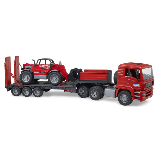 A red toy truck with trailer is carrying a red loader. The loader is secured on the flatbed, and the truck has six wheels. The scene is clean and organized.