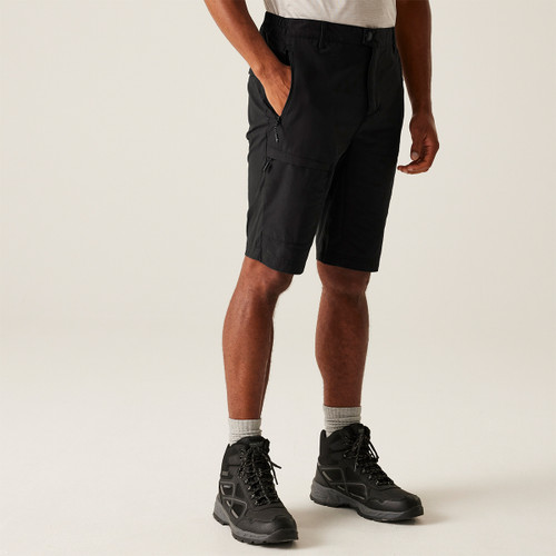 A front view of a man wearing black Regatta walking shorts on a white background