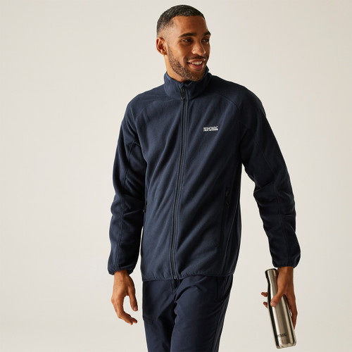A front view of a man wearing a navy Regatta full zip fleece on a white background