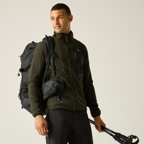 A front view of a man wearing a dark green full zip Regatta fleece on a white background