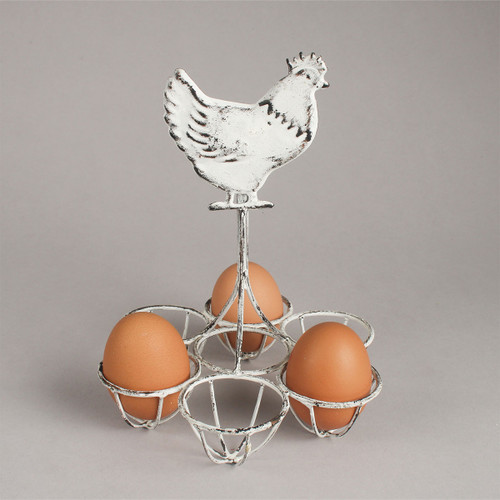 A rustic egg holder with a chicken silhouette on top, displaying three brown eggs in a metal frame against a simple gray background.