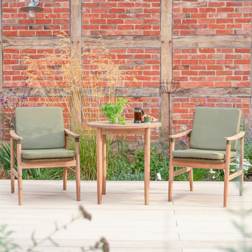 Kettler Meadow 2 seat bistro set with round wooden table and two rope weave armchairs with green cushions on a garden patio.