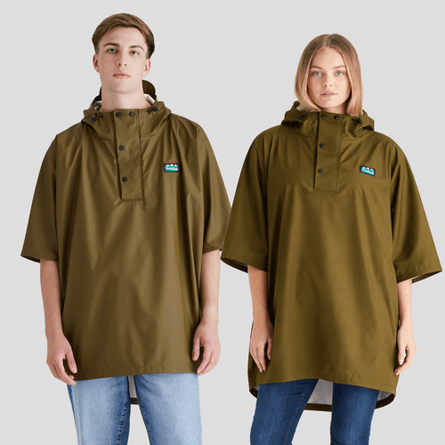 Olive green waterproof poncho with a hood, black button placket, wide sleeves, and a small chest logo patch, shown on two models.