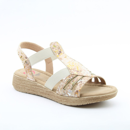 Beige wedge sandal with a floral-patterned upper, elastic straps, and a textured platform sole on a white background.