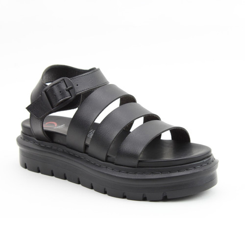 Black strappy platform sandal with an ankle buckle and chunky lug sole, on a white background.
