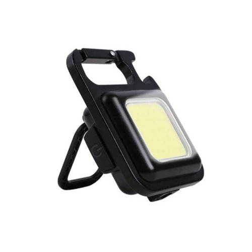 A compact black LED work light with a bright yellow panel. It features a sturdy handle and a foldable stand, conveying a sense of portability and efficiency.