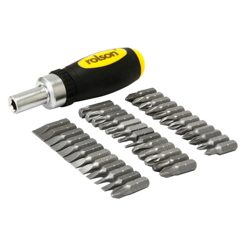 A black and yellow screwdriver with a set of four rows of silver interchangeable bits arranged beside it, showcasing a versatile tool set.