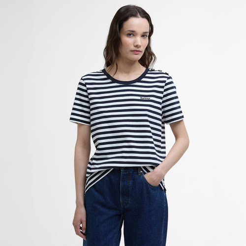 Model wearing a navy and white striped Barbour T-shirt with shoulder button detail, styled with dark blue jeans.