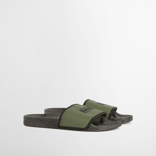 Olive green Barbour slider sandals shown in side view, featuring a wide branded strap and black cushioned footbed on a white studio background.