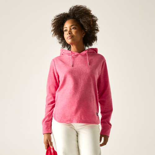 Model wearing a pink marl hooded sweatshirt with drawcords, shown from the front with white trousers.