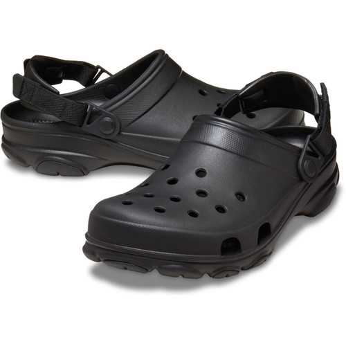 Pair of black Crocs clogs angled together, highlighting perforated upper, textured midsole and pivoting heel straps.