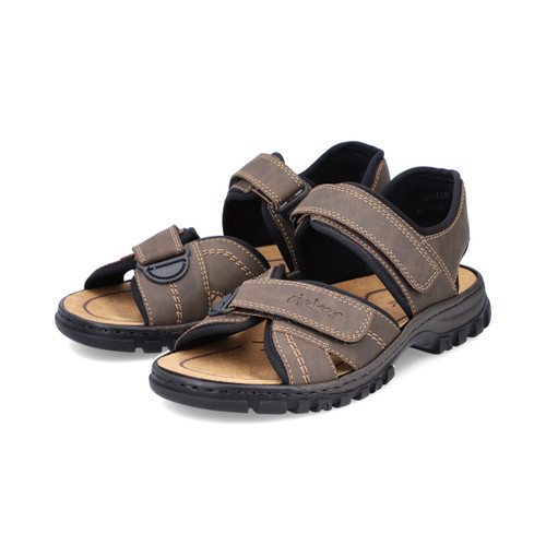 Pair of brown Rieker sandals with adjustable straps and chunky black sole, angled view.