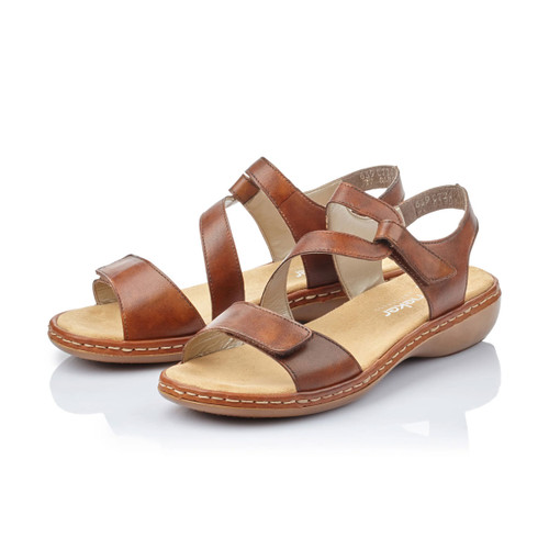 Brown Rieker sandals with adjustable straps, shown as a pair from the front side.