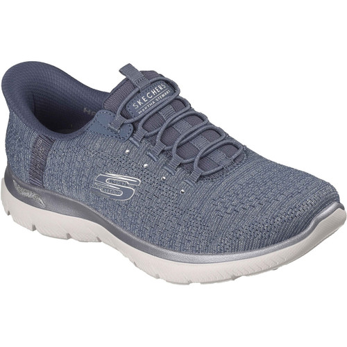 Blue athletic trainer with knit fabric upper, light grey sole, and elastic laces. Features "S" logo and "Skechers" on the tongue. Casual, sporty look.