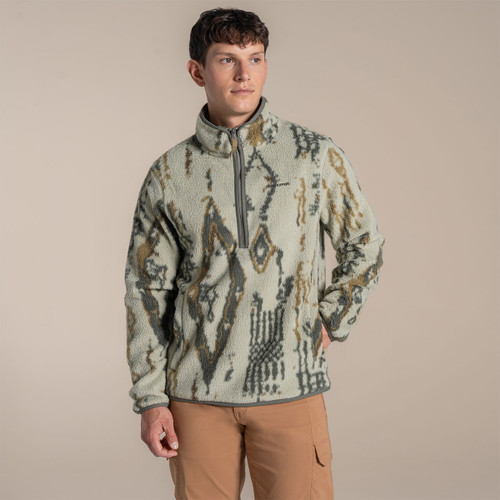 Three-quarter studio shot of a male model wearing the patterned half-zip fleece, showing the relaxed fit and stand collar.