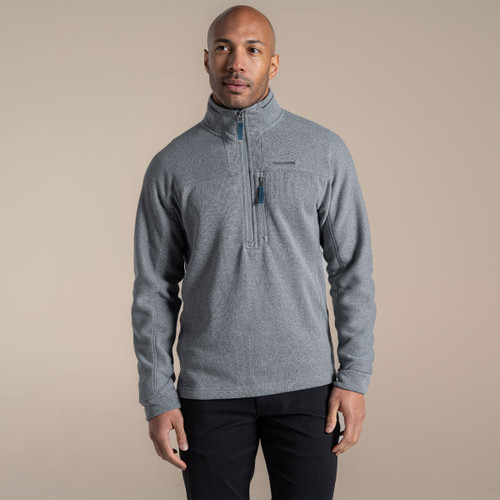 Model wearing grey half-zip fleece, front view, with stand collar and vertical zipped chest pocket.