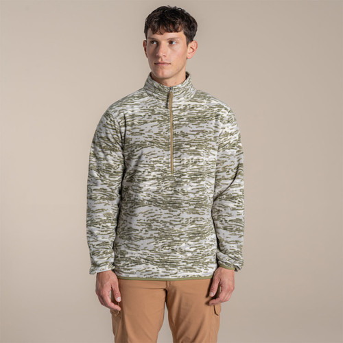 Model wearing an olive and cream patterned half-zip fleece with a stand collar, front view.
